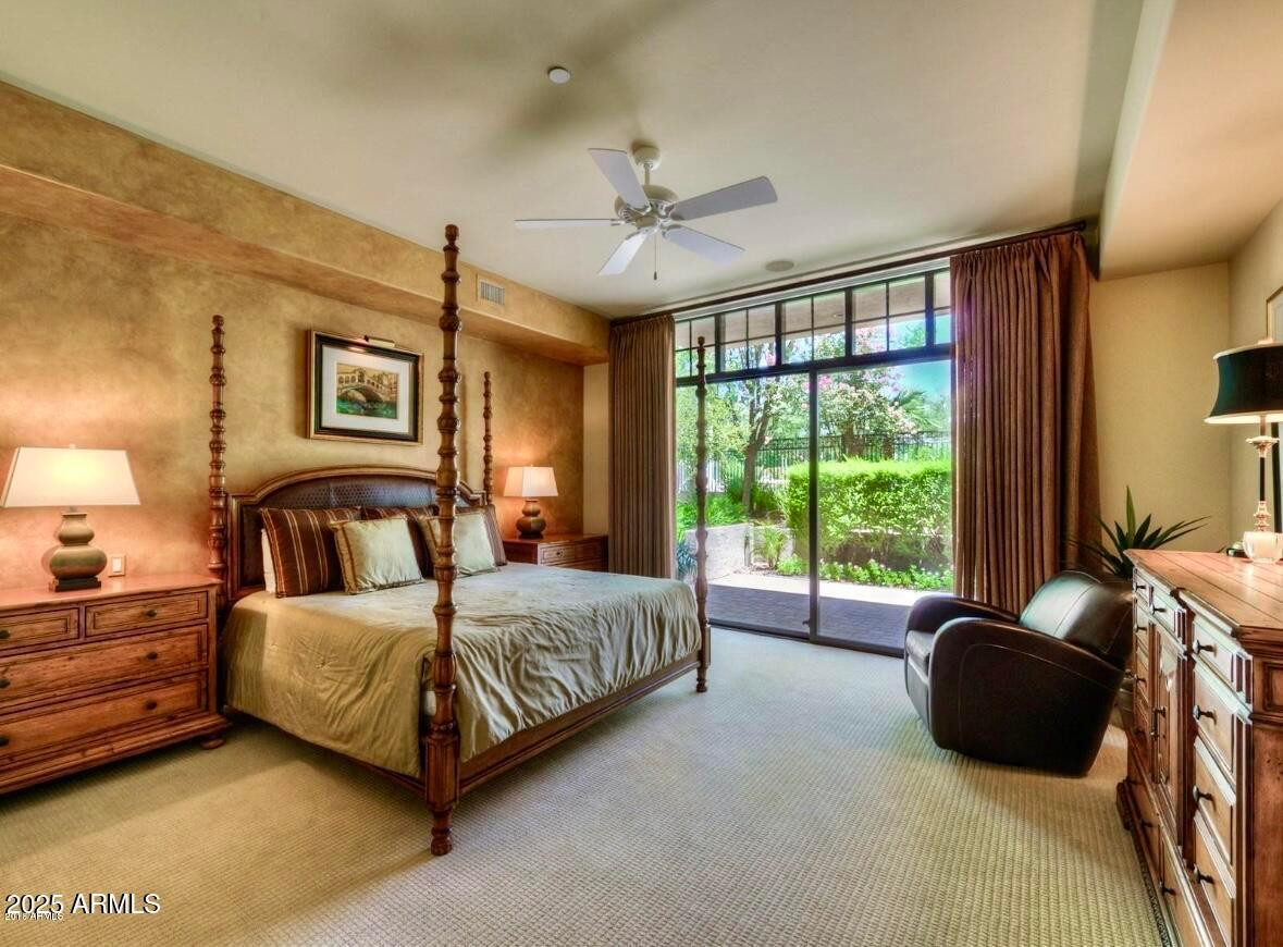 8 Biltmore Estate, Unit 112 Phoenix, AZ 85016 - Photo 9 of 14 a bedroom with a bed and a large window