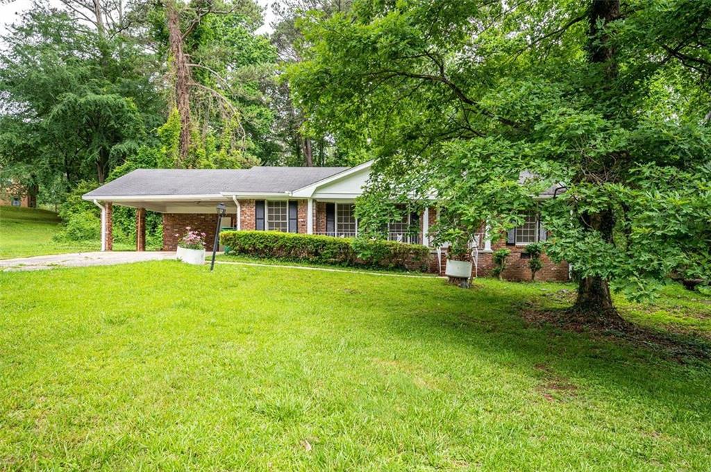 2205 Langdon Court Decatur, GA 30035 - Photo 1 of 1 a front view of a house with a yard