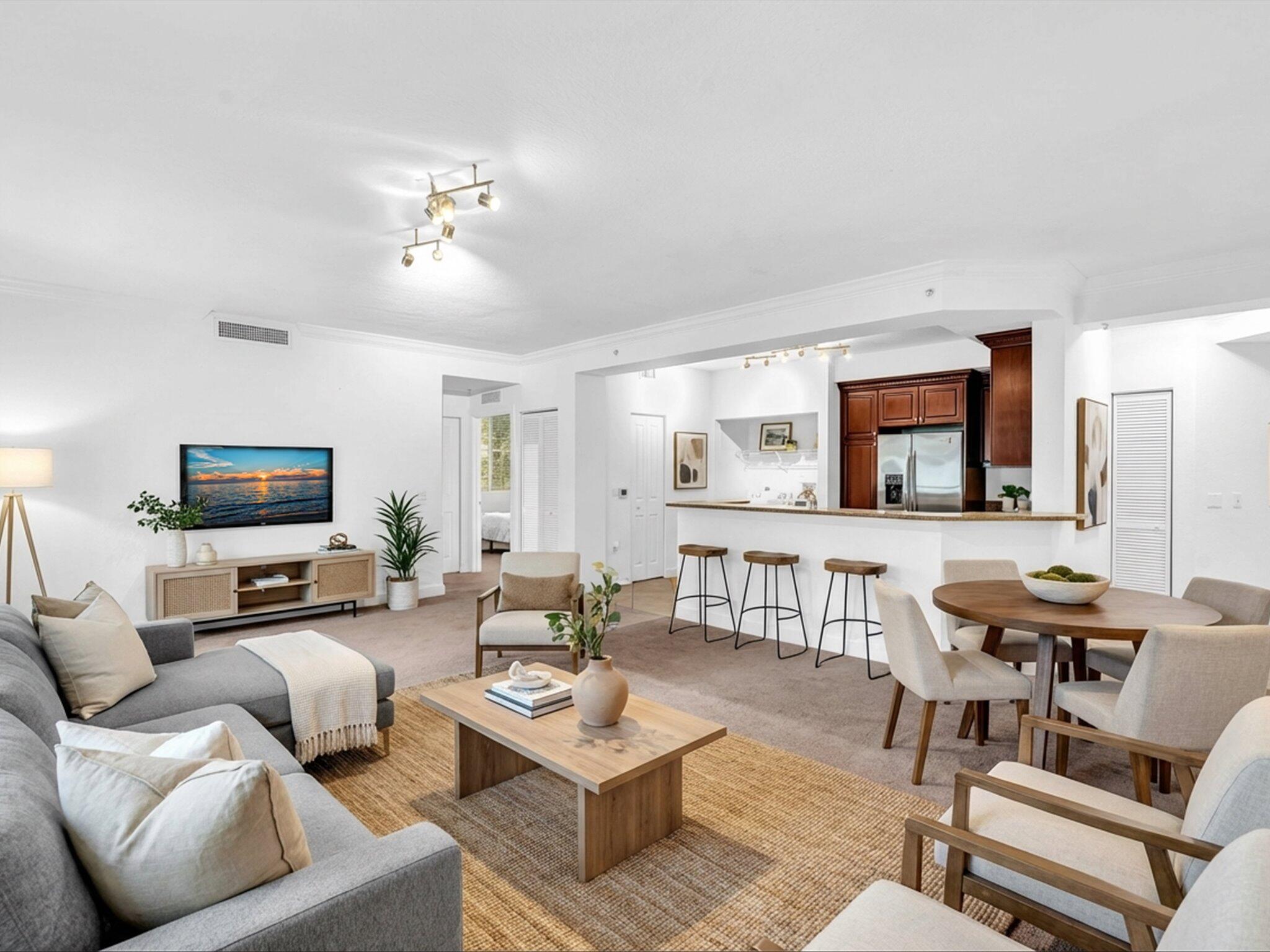 4303 Renaissance Way, Unit 303 Boynton Beach, FL 33426 - Photo 14 of 74 a living room with furniture and a flat screen tv