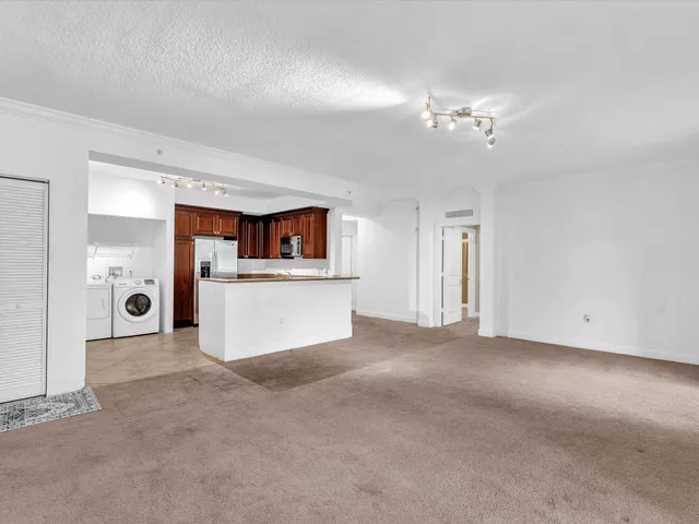 a kitchen with stainless steel appliances granite countertop a stove and a sink