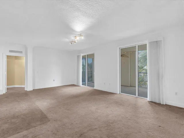 a kitchen with a stove sink and cabinets