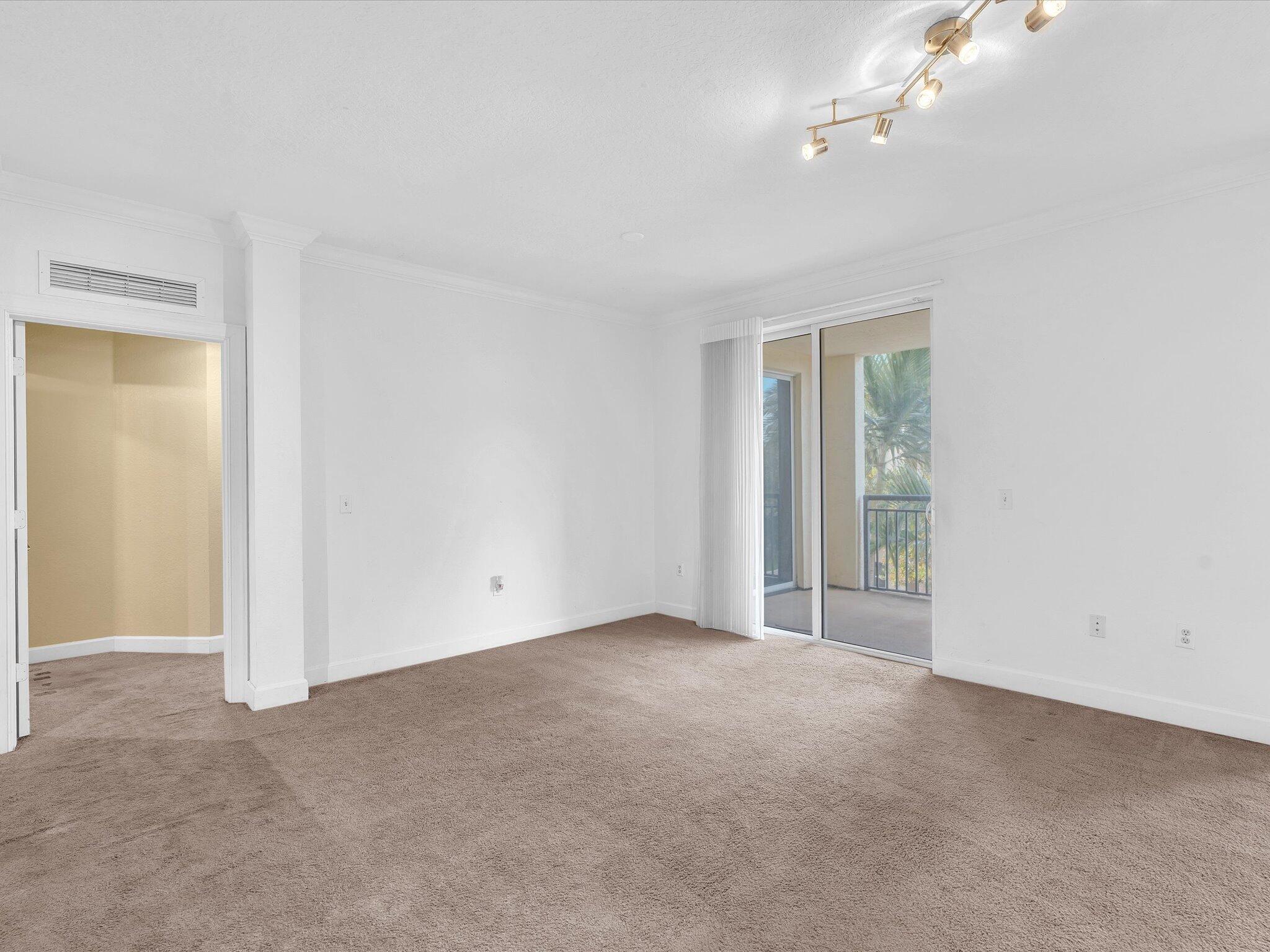 4303 Renaissance Way, Unit 303 Boynton Beach, FL 33426 - Photo 18 of 74 a view of an empty room with a window