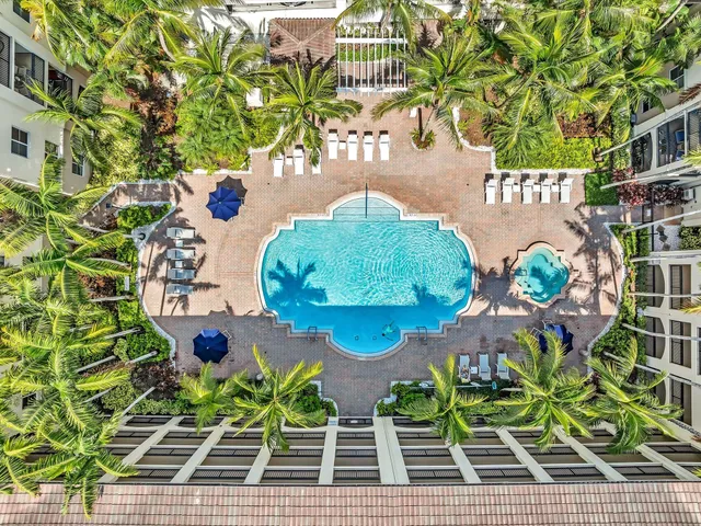 a view of a swimming pool with sitting area