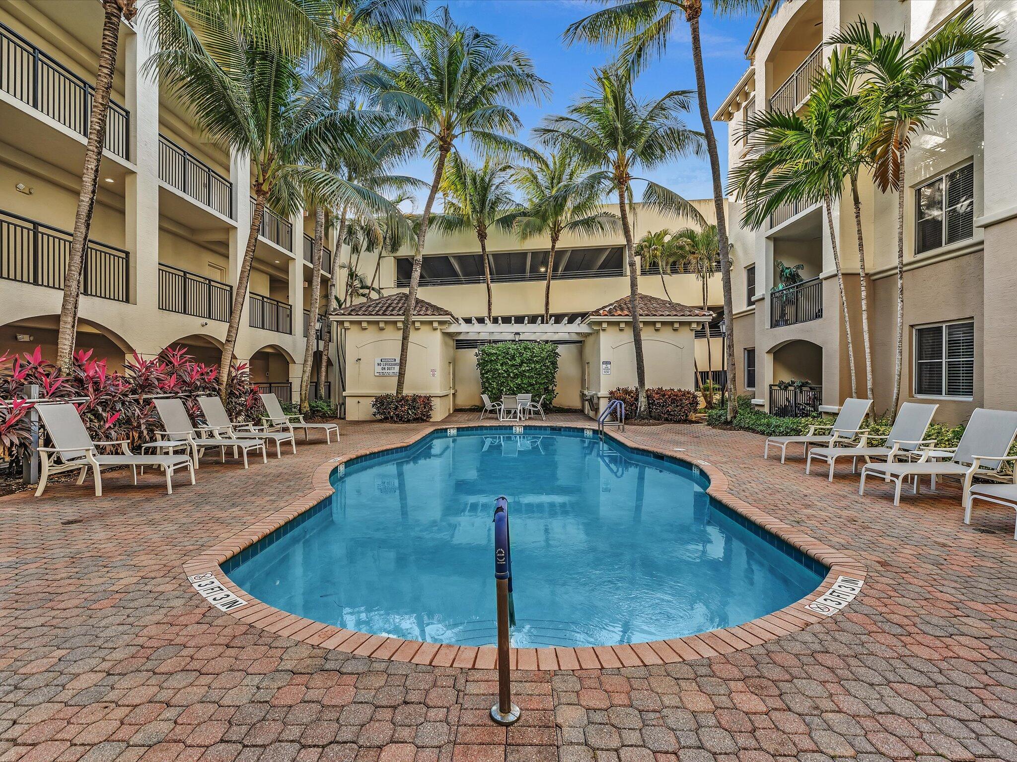 4303 Renaissance Way, Unit 303 Boynton Beach, FL 33426 - Photo 3 of 74 a view of a swimming pool with sitting area