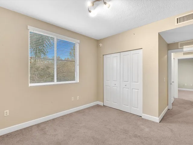 a view of a livingroom with furniture and a flat screen tv