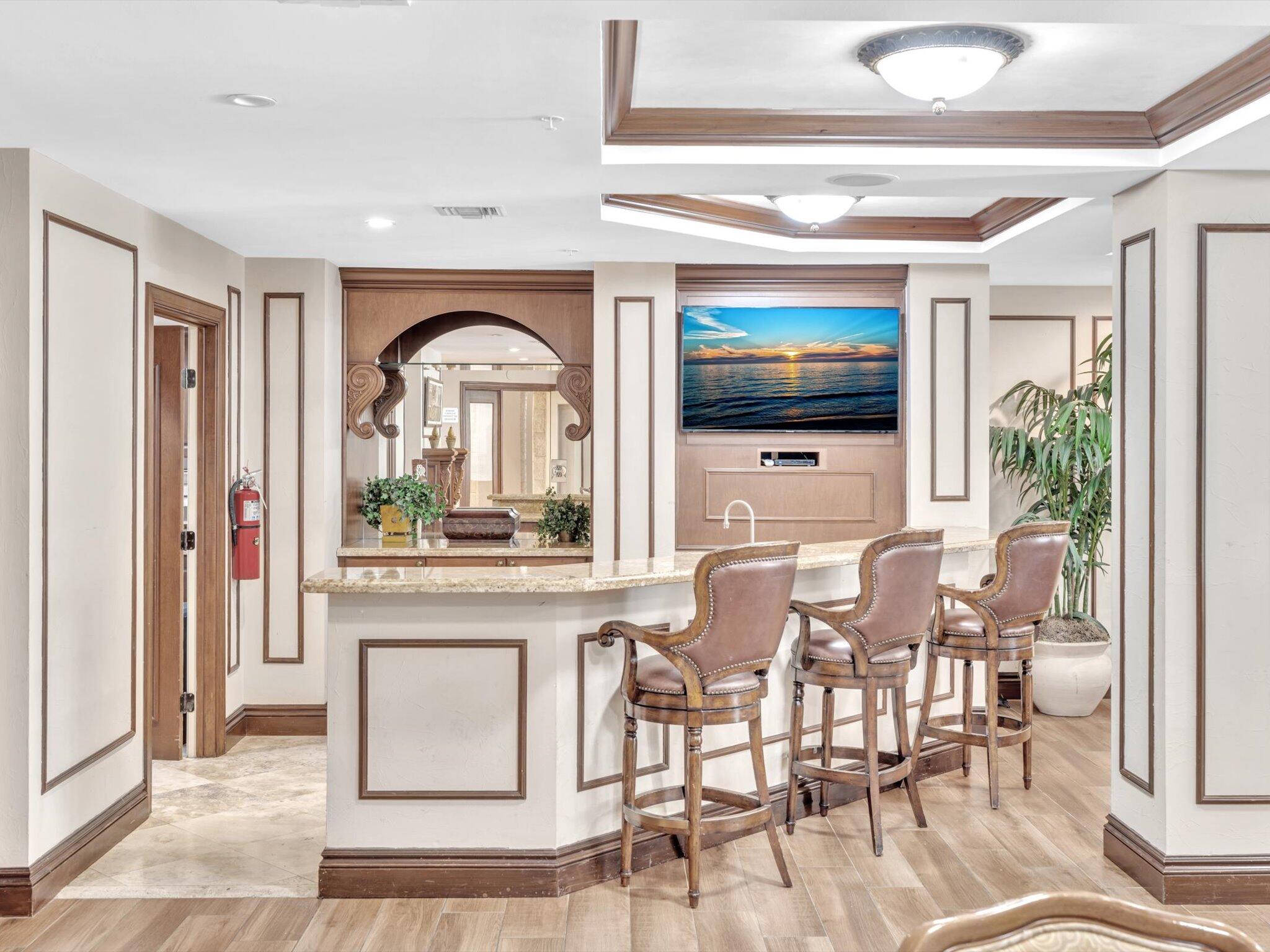 4303 Renaissance Way, Unit 303 Boynton Beach, FL 33426 - Photo 54 of 74 a view of a livingroom with furniture and a flat screen tv