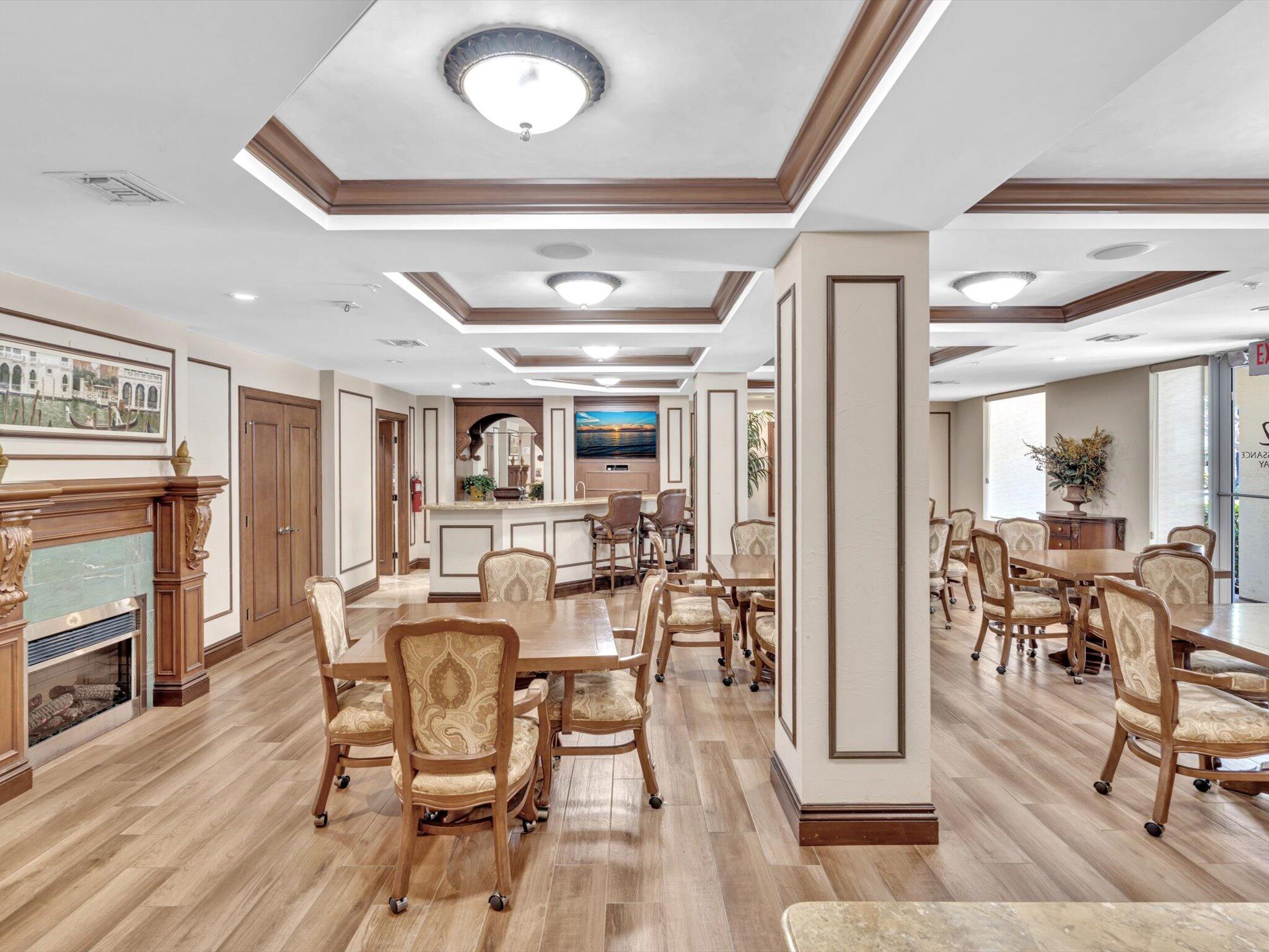 4303 Renaissance Way, Unit 303 Boynton Beach, FL 33426 - Photo 56 of 74 a view of a dining room with furniture window and wooden floor