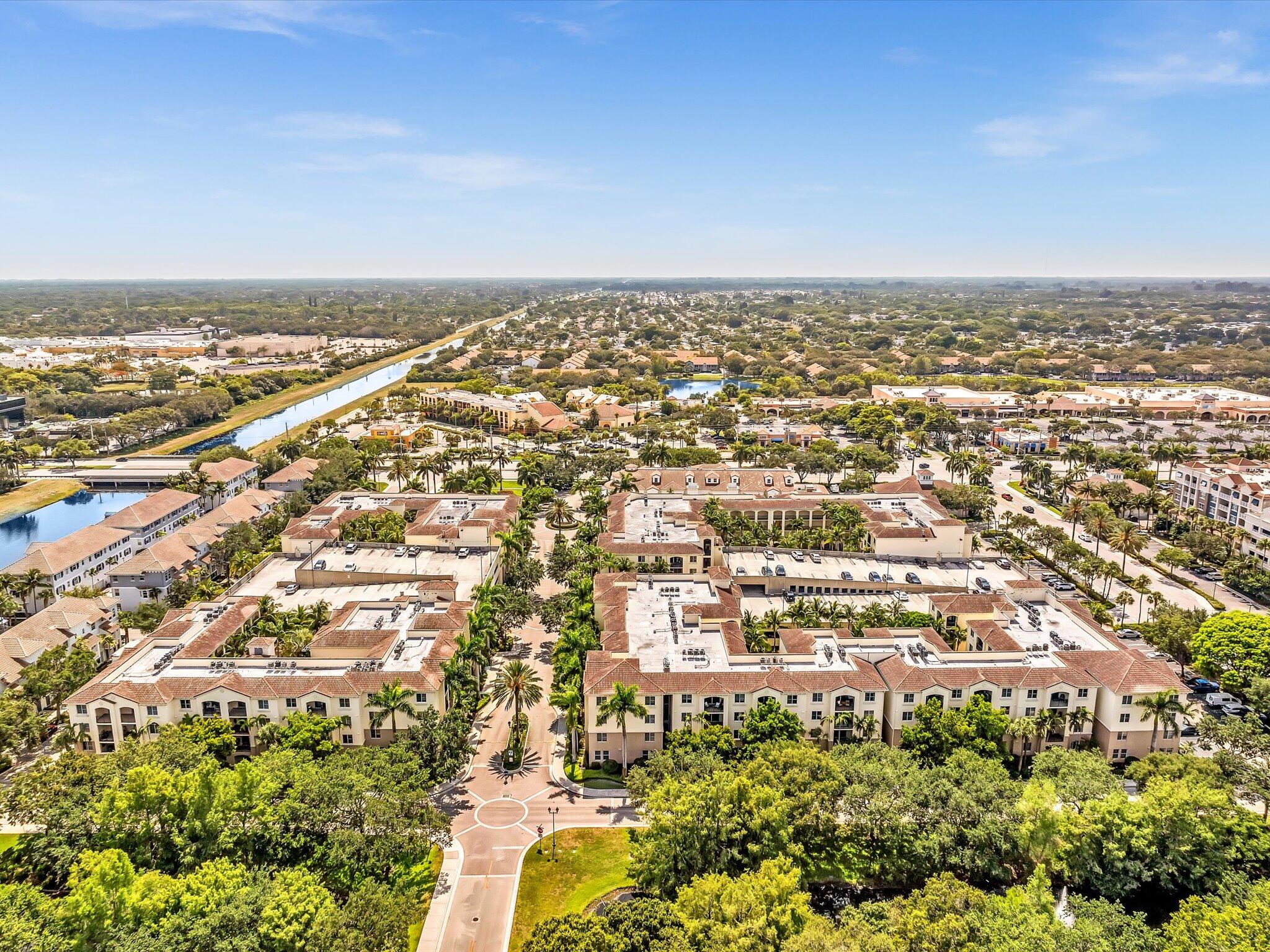 4303 Renaissance Way, Unit 303 Boynton Beach, FL 33426 - Photo 66 of 74 an aerial view of residential building with parking space