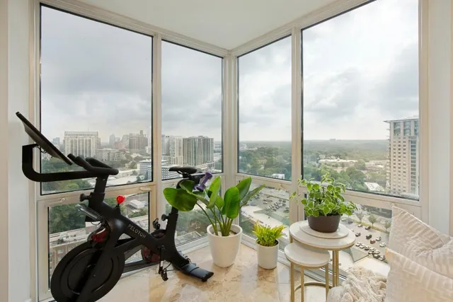 a view of a porch with furniture and a potted plant