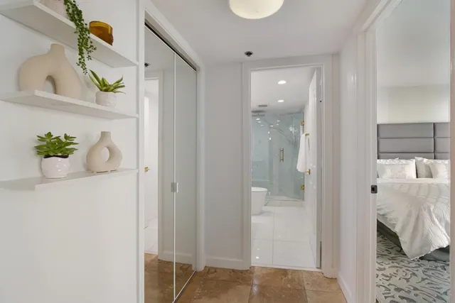 a bedroom with a large bed and a couch