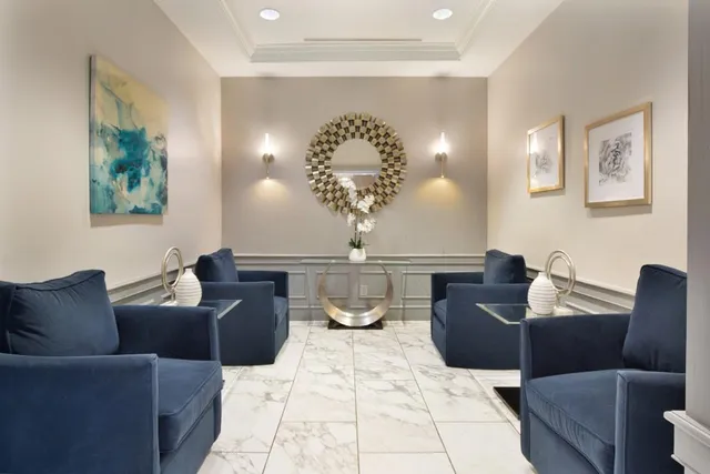 a vase of flowers sitting on a floor