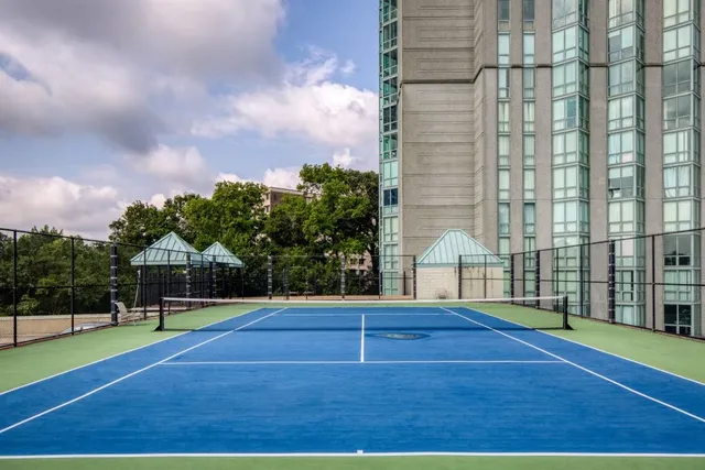 a view of a tall building with a yard