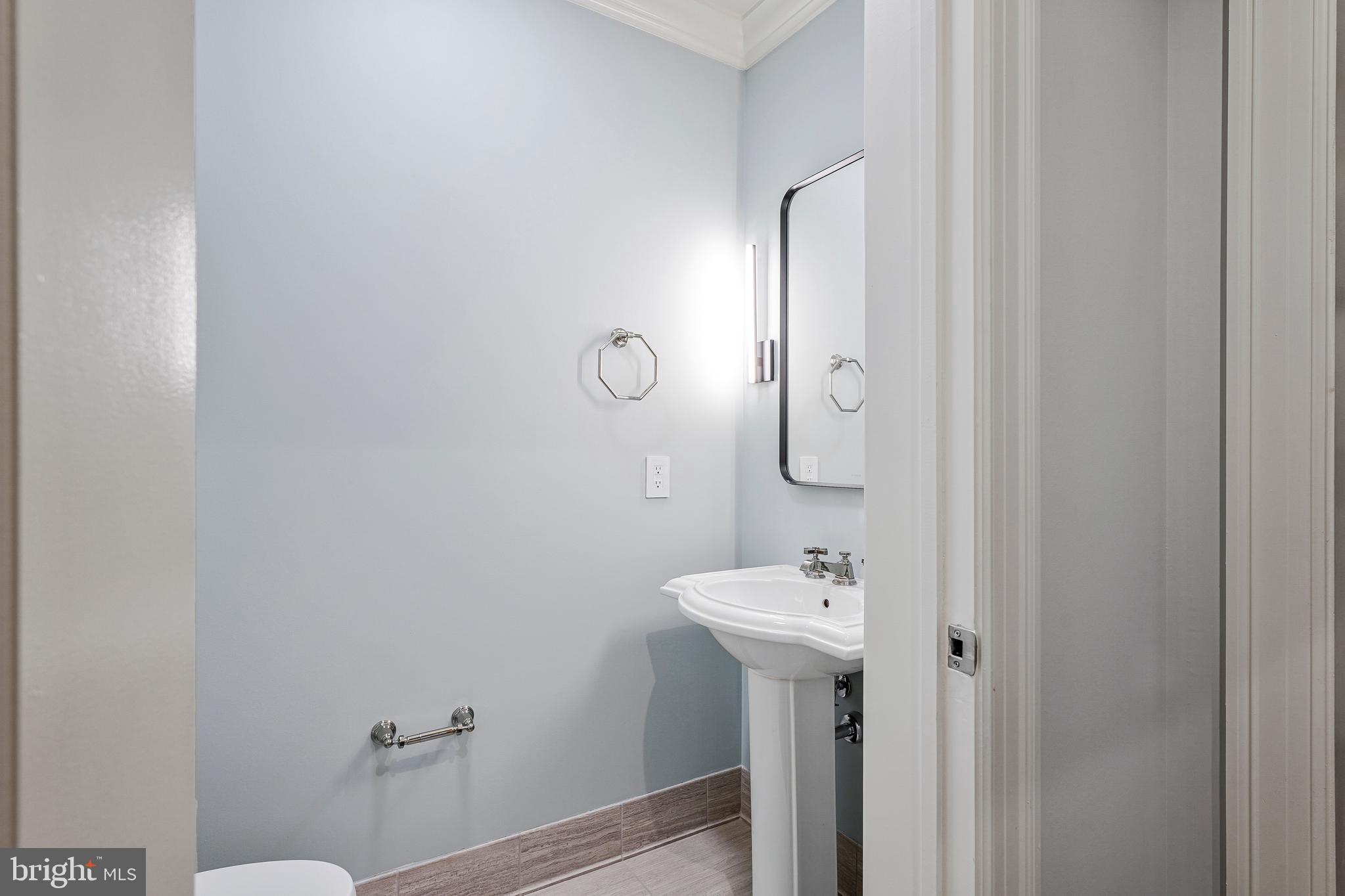 6900 Fleetwood Road, Unit 317 McLean, VA 22101 - Photo 15 of 56 a bathroom with a sink mirror and toilet