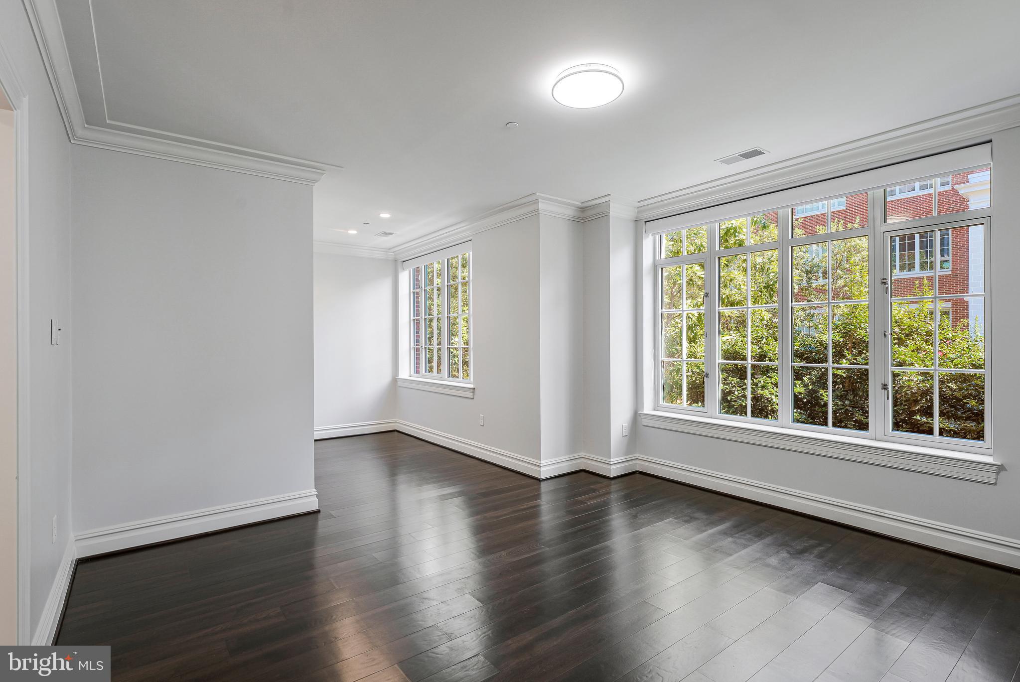 6900 Fleetwood Road, Unit 317 McLean, VA 22101 - Photo 16 of 56 wooden floor in an empty room with a window