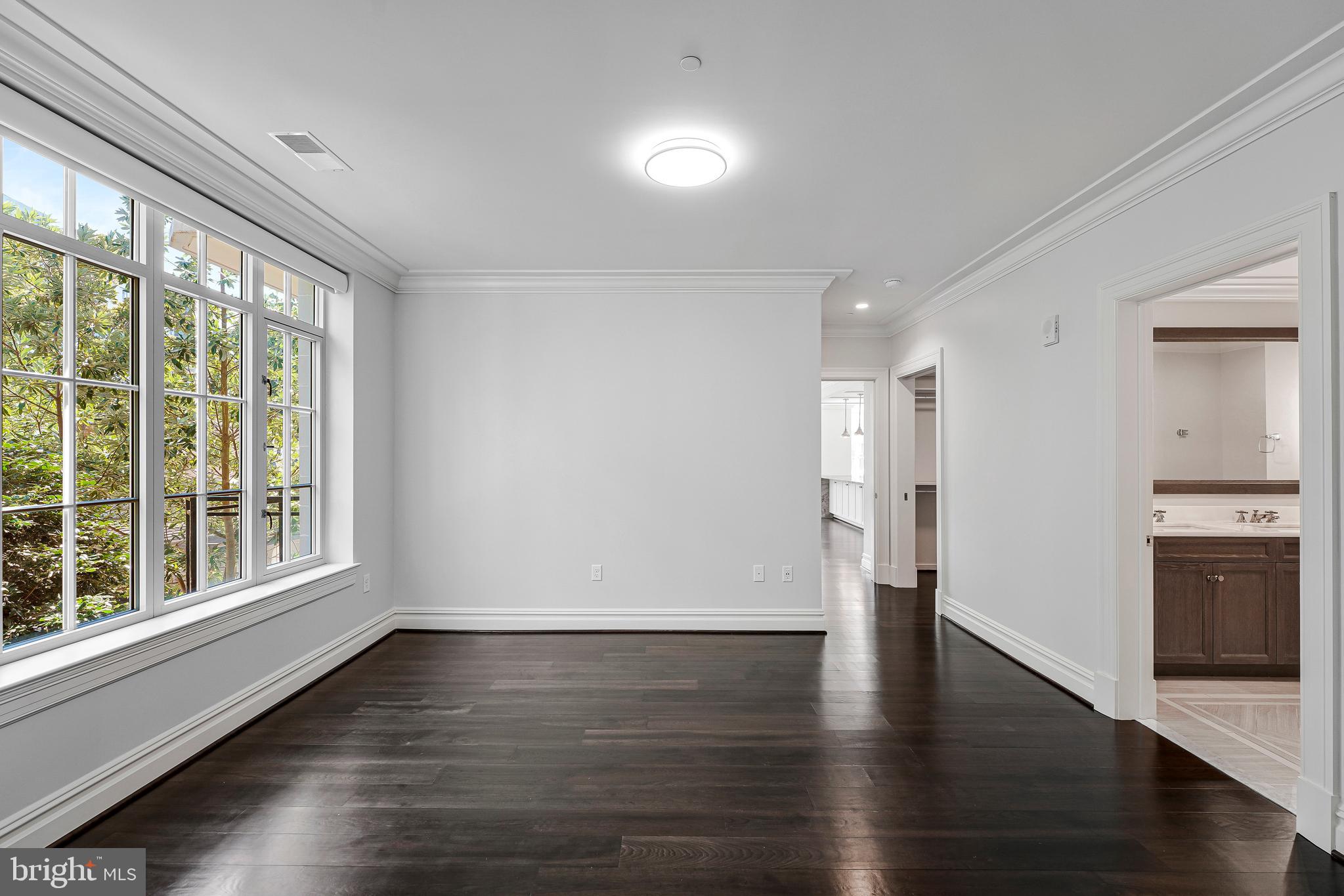 6900 Fleetwood Road, Unit 317 McLean, VA 22101 - Photo 17 of 56 wooden floor in an empty room with a window
