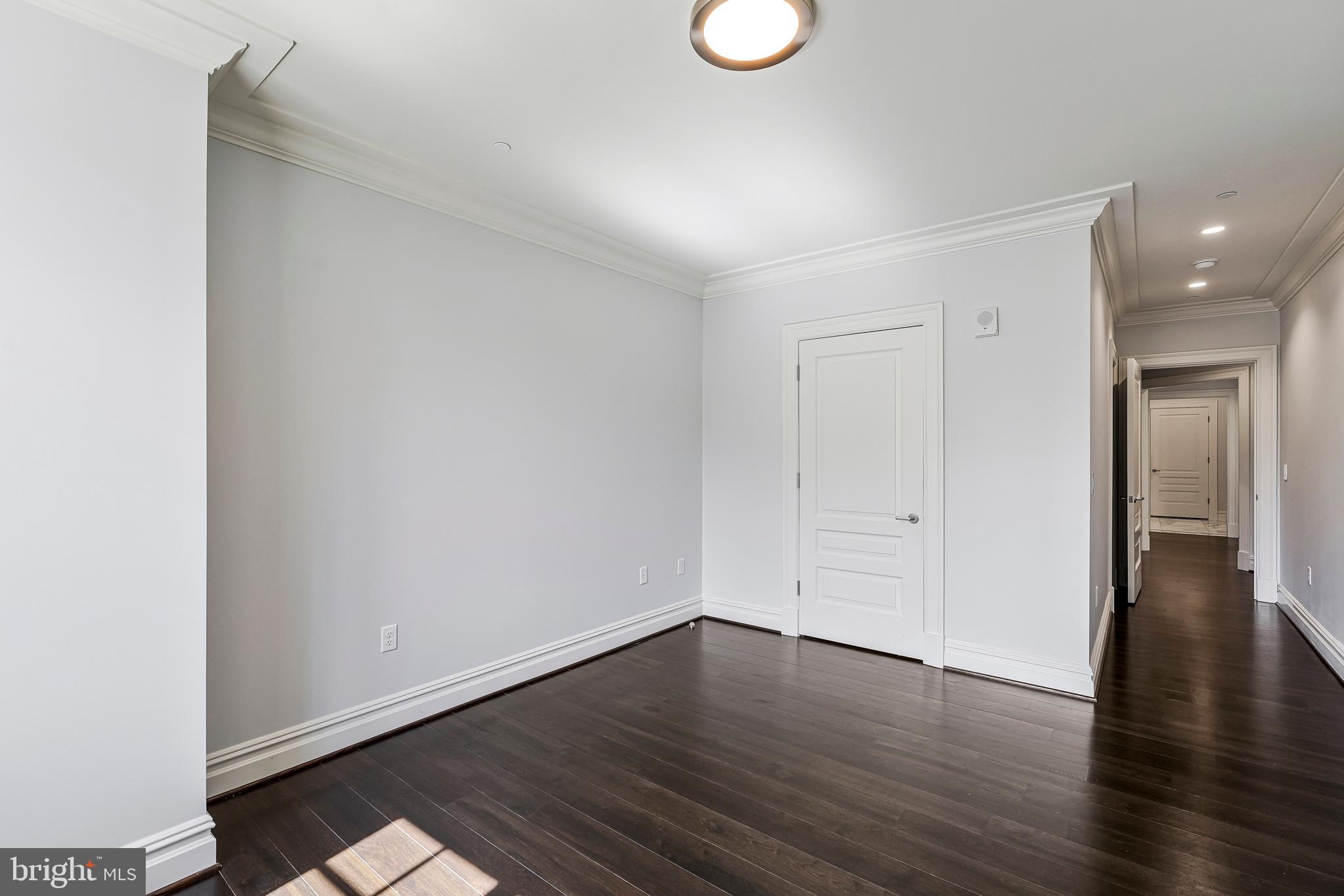 6900 Fleetwood Road, Unit 317 McLean, VA 22101 - Photo 23 of 56 a view of an empty room with wooden floor
