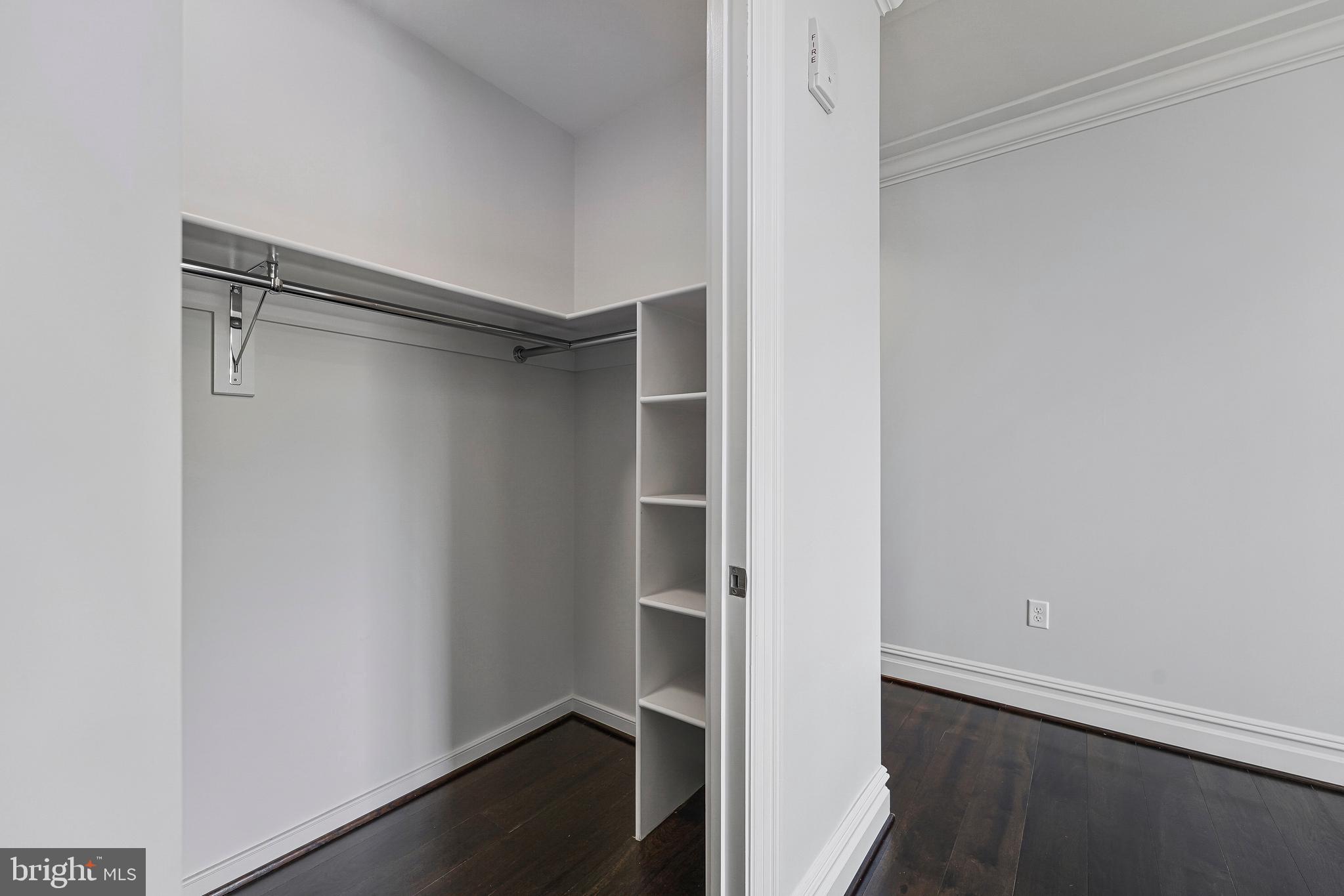 6900 Fleetwood Road, Unit 317 McLean, VA 22101 - Photo 24 of 56 a view of walk in closet with empty racks