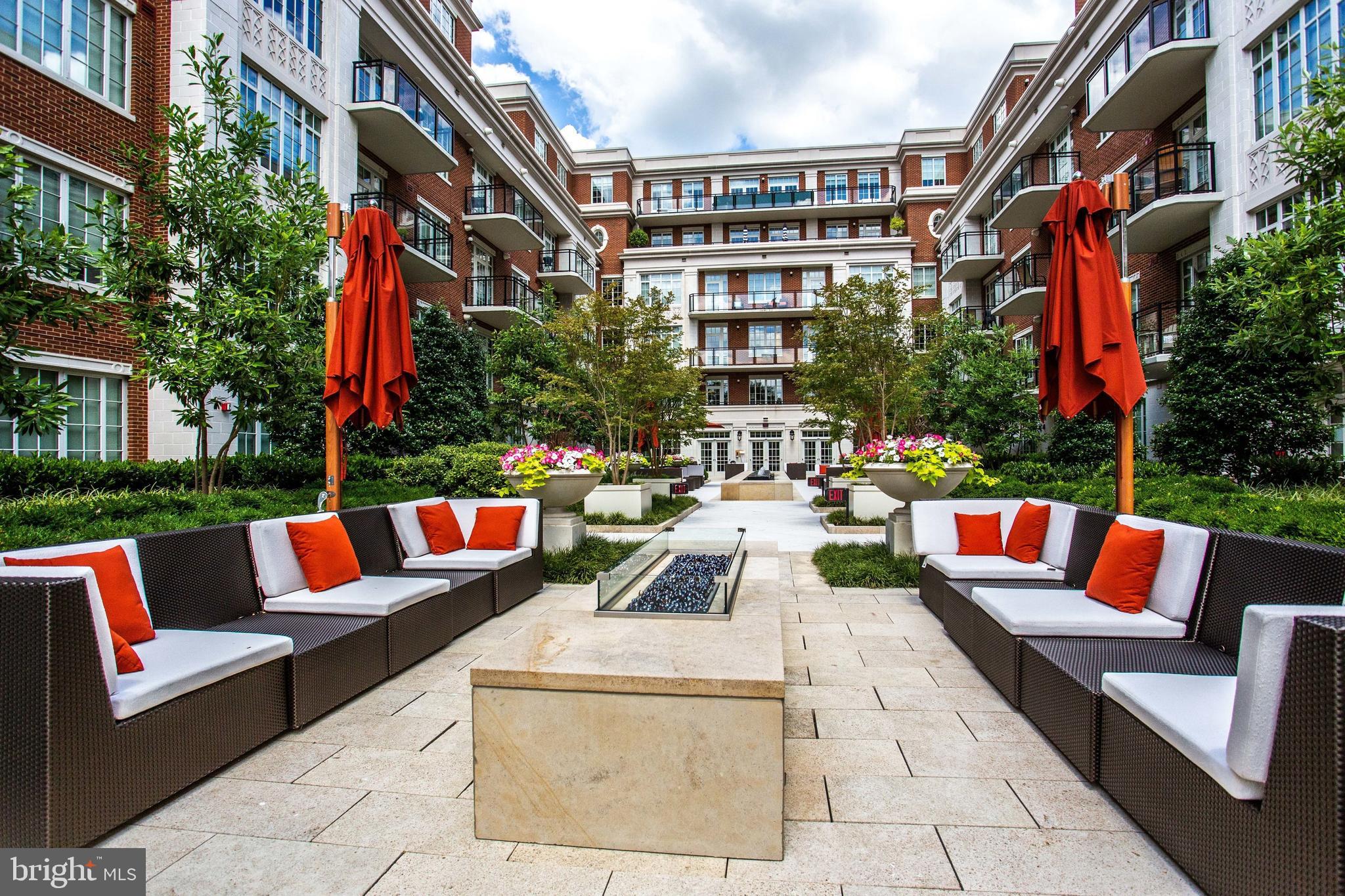 6900 Fleetwood Road, Unit 317 McLean, VA 22101 - Photo 35 of 56 a view of patio with couches and a fire pit