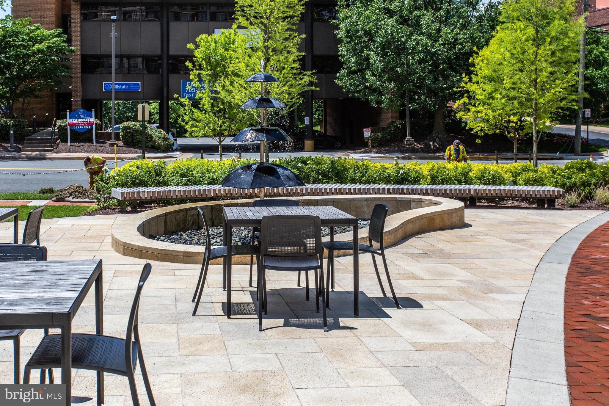 6900 Fleetwood Road, Unit 317 McLean, VA 22101 - Photo 37 of 56 a patio with table and chairs