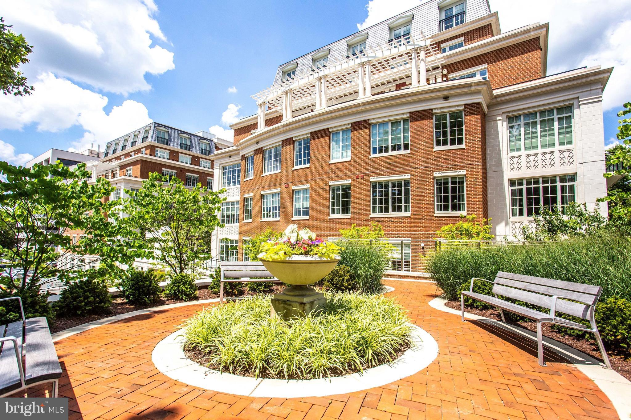6900 Fleetwood Road, Unit 317 McLean, VA 22101 - Photo 41 of 56 a view of a swimming pool with a lounge chairs in patio