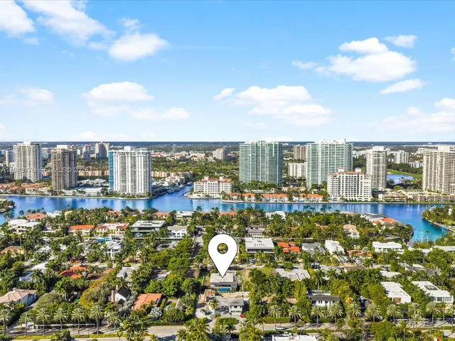 an aerial view of a residential houses with outdoor space