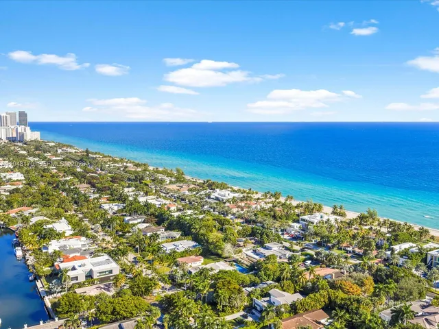 a view of a swimming pool with a yard