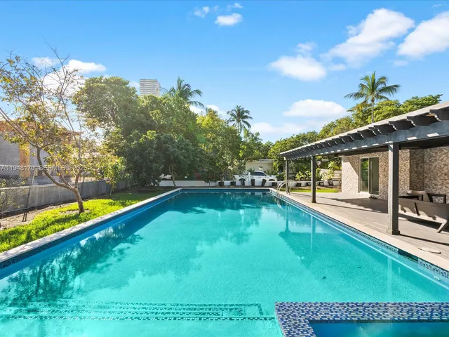 a view of a house with swimming pool