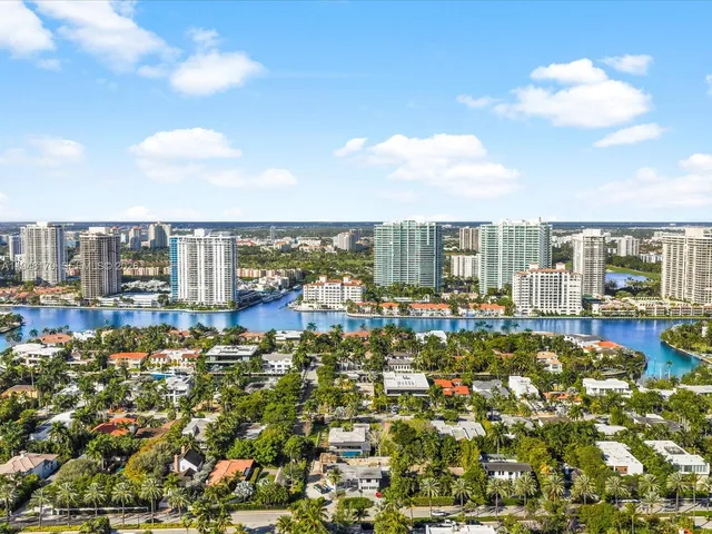 a patio with table and chairs and a yard with wooden floor