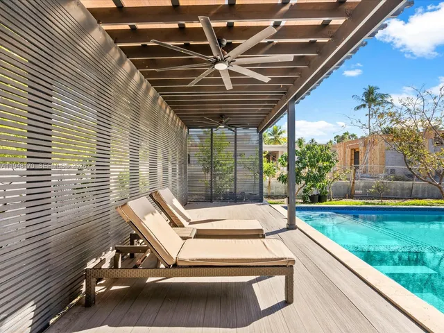 a view of a dining room with furniture and window