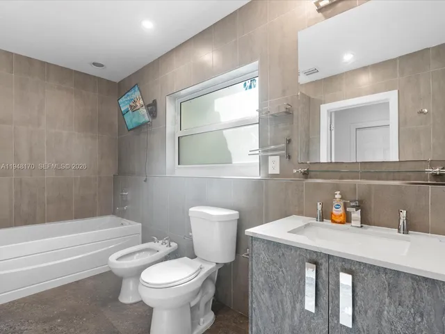 an aerial view of a houses with yard