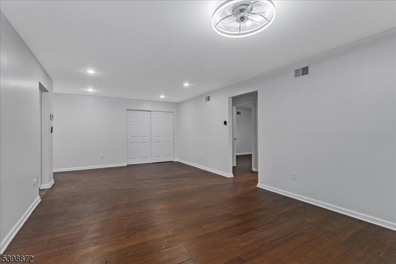 56 Maple Lane Mount Arlington, NJ 07856 - Photo 2 of 34 an empty room with wooden floor and a window