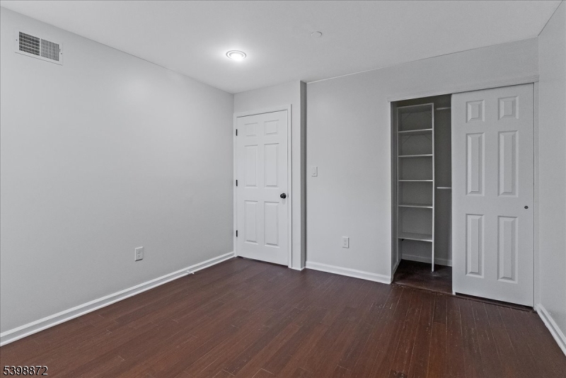 56 Maple Lane Mount Arlington, NJ 07856 - Photo 22 of 34 a view of an empty room with wooden floor