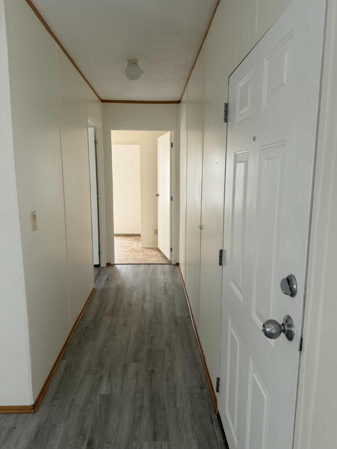 24455 Needham Road Porter, TX 77365 - Photo 5 of 8 a view of a hallway with wooden floor