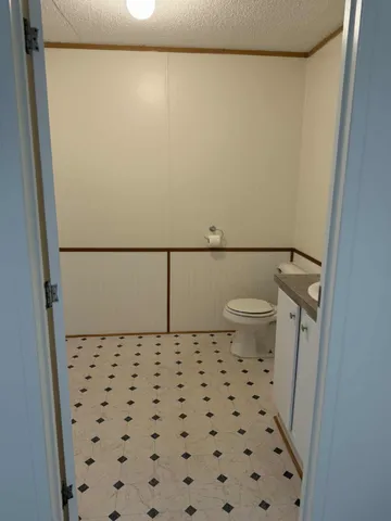 a bathroom with a shower and a toilet
