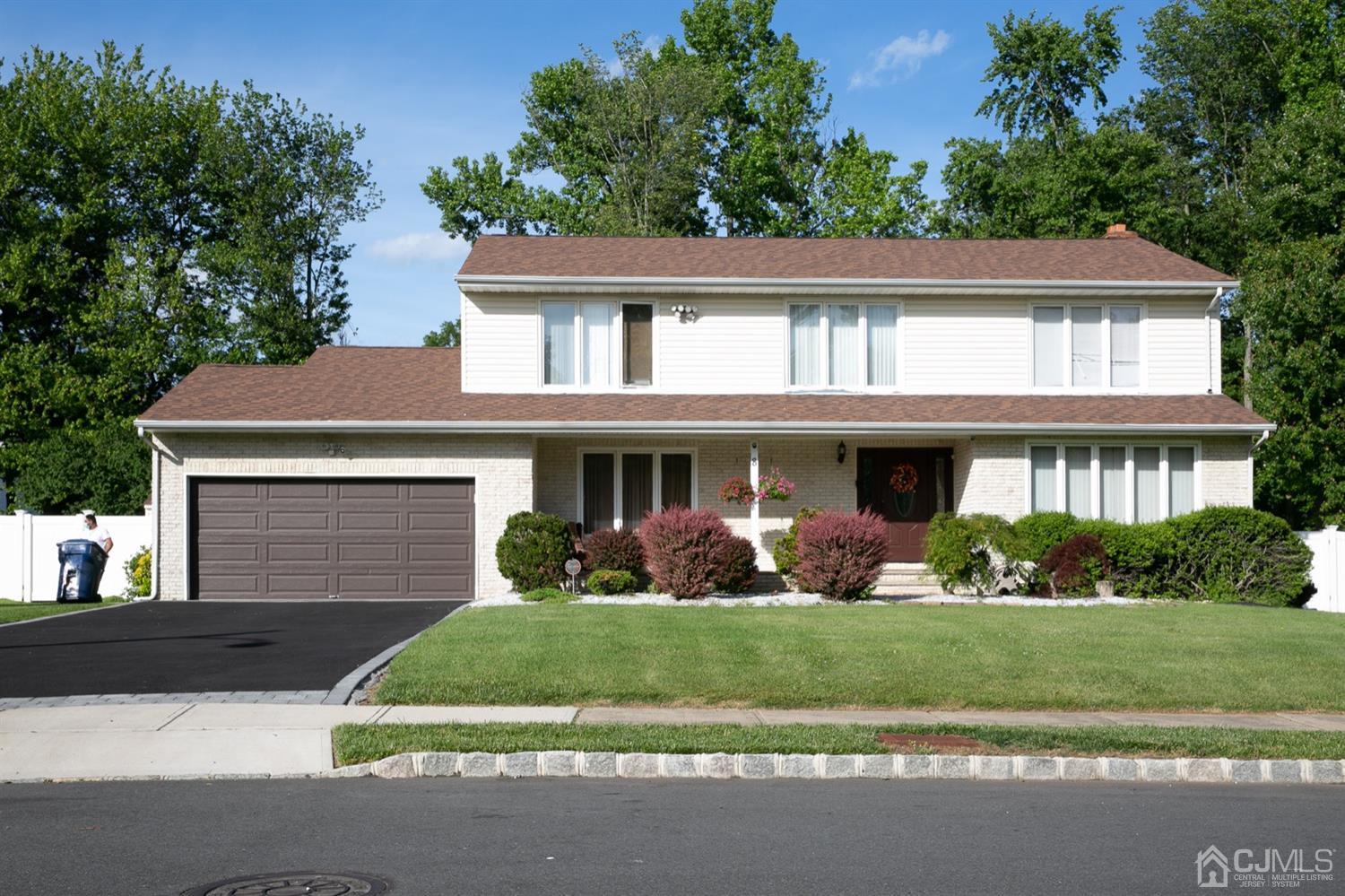 8 Peppermint Hill Road North Brunswick, NJ 08902 - Photo 1 of 32 a front view of a house with a yard