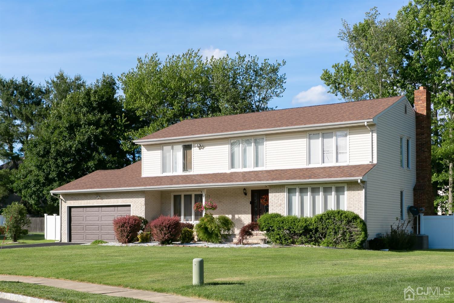 8 Peppermint Hill Road North Brunswick, NJ 08902 - Photo 2 of 32 front view of a house with a yard