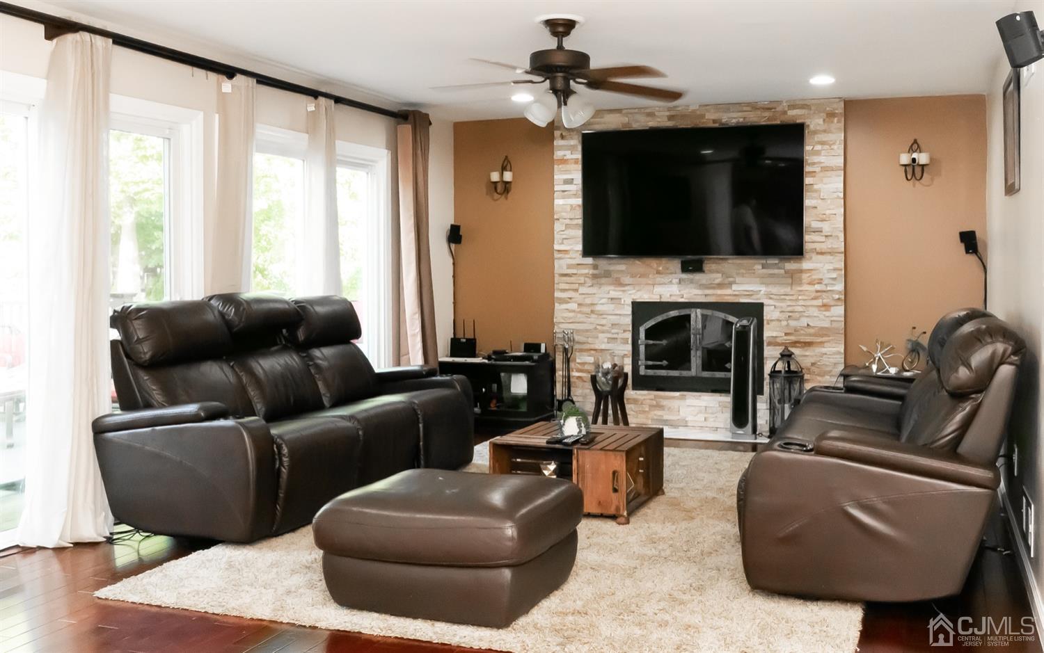 8 Peppermint Hill Road North Brunswick, NJ 08902 - Photo 14 of 32 a living room with furniture fireplace and flat screen tv