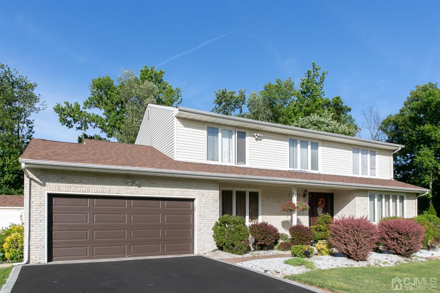 8 Peppermint Hill Road North Brunswick, NJ 08902 - Photo 3 of 32 a front view of a house with garden