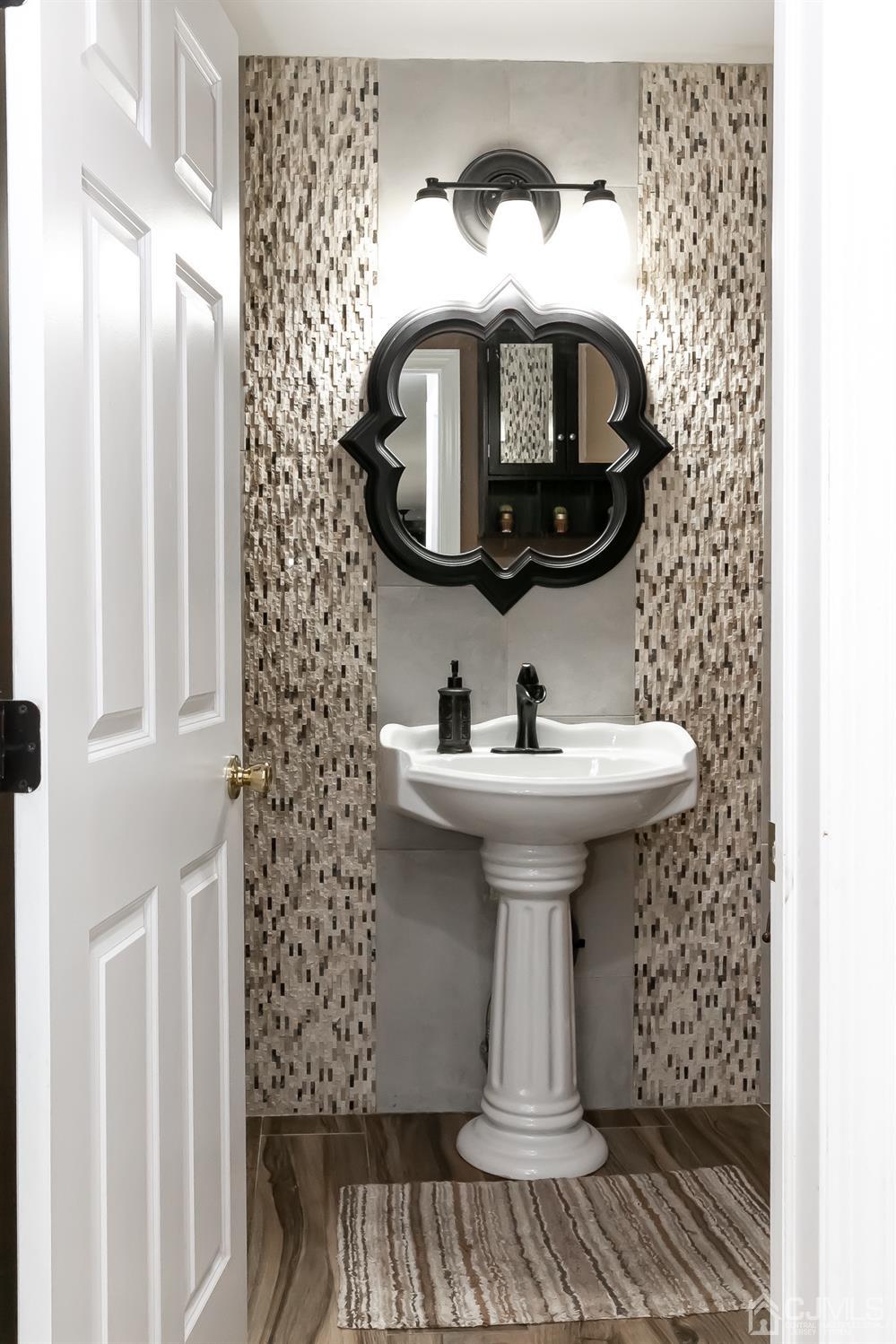 8 Peppermint Hill Road North Brunswick, NJ 08902 - Photo 22 of 32 a bathroom with a sink and a mirror