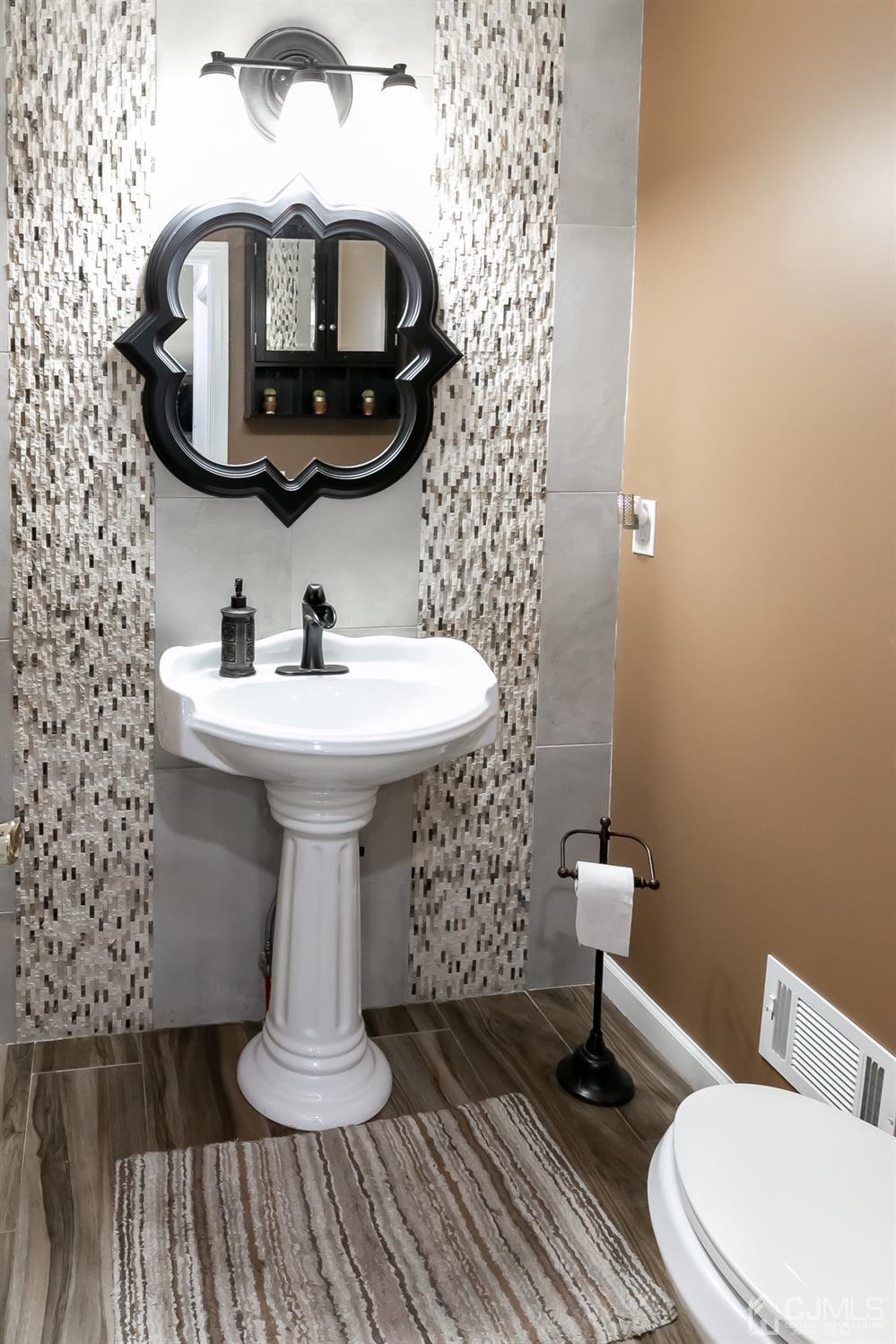 8 Peppermint Hill Road North Brunswick, NJ 08902 - Photo 23 of 32 a bathroom with a sink toilet and mirror