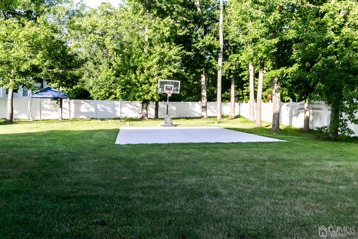 8 Peppermint Hill Road North Brunswick, NJ 08902 - Photo 24 of 32 a view of a backyard with large trees