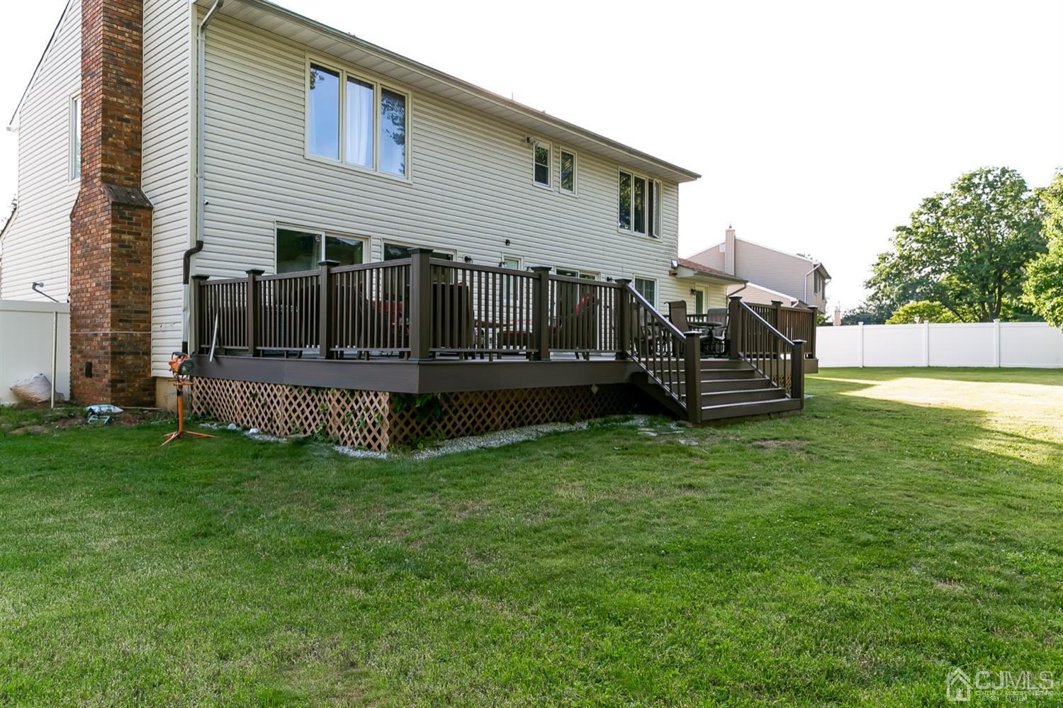 8 Peppermint Hill Road North Brunswick, NJ 08902 - Photo 25 of 32 a view of a house with a backyard