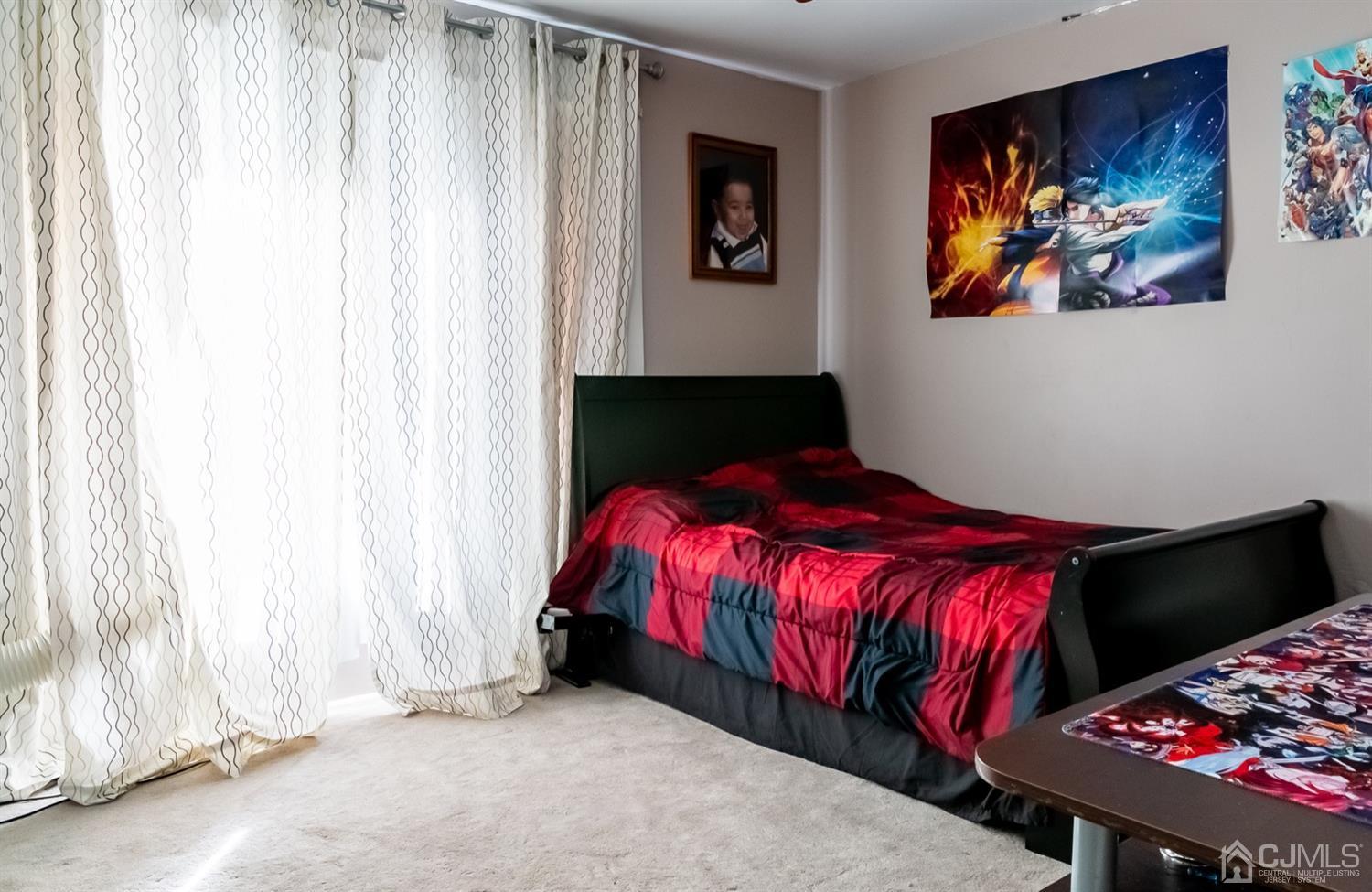 8 Peppermint Hill Road North Brunswick, NJ 08902 - Photo 5 of 32 a bed sitting in a bedroom next to a cabinet