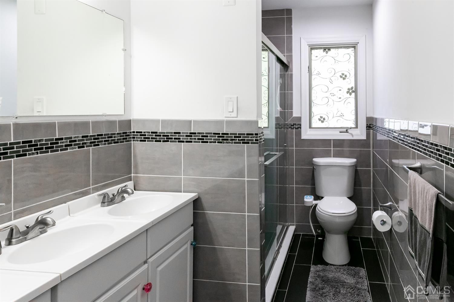 8 Peppermint Hill Road North Brunswick, NJ 08902 - Photo 8 of 32 a bathroom with a sink toilet and shower