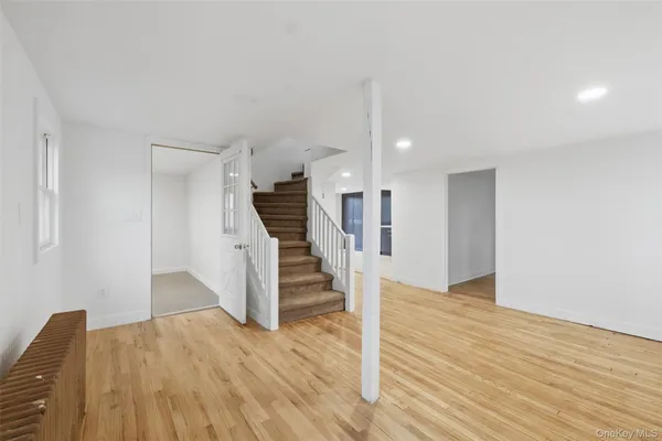 a view of entryway with wooden floor