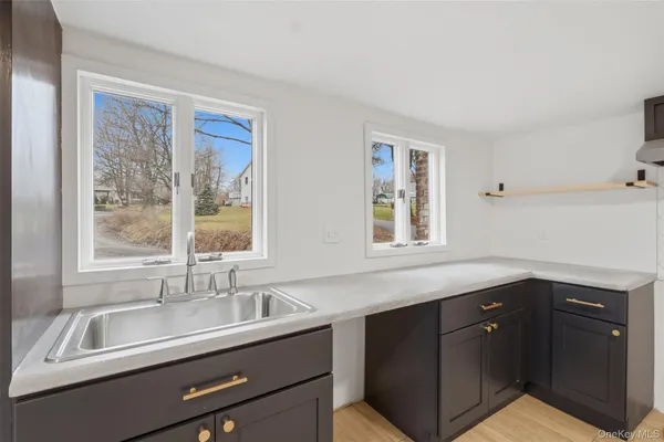 a kitchen with a sink and a window