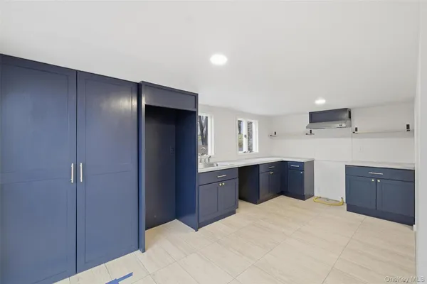 a kitchen with stainless steel appliances granite countertop a refrigerator and wooden cabinets