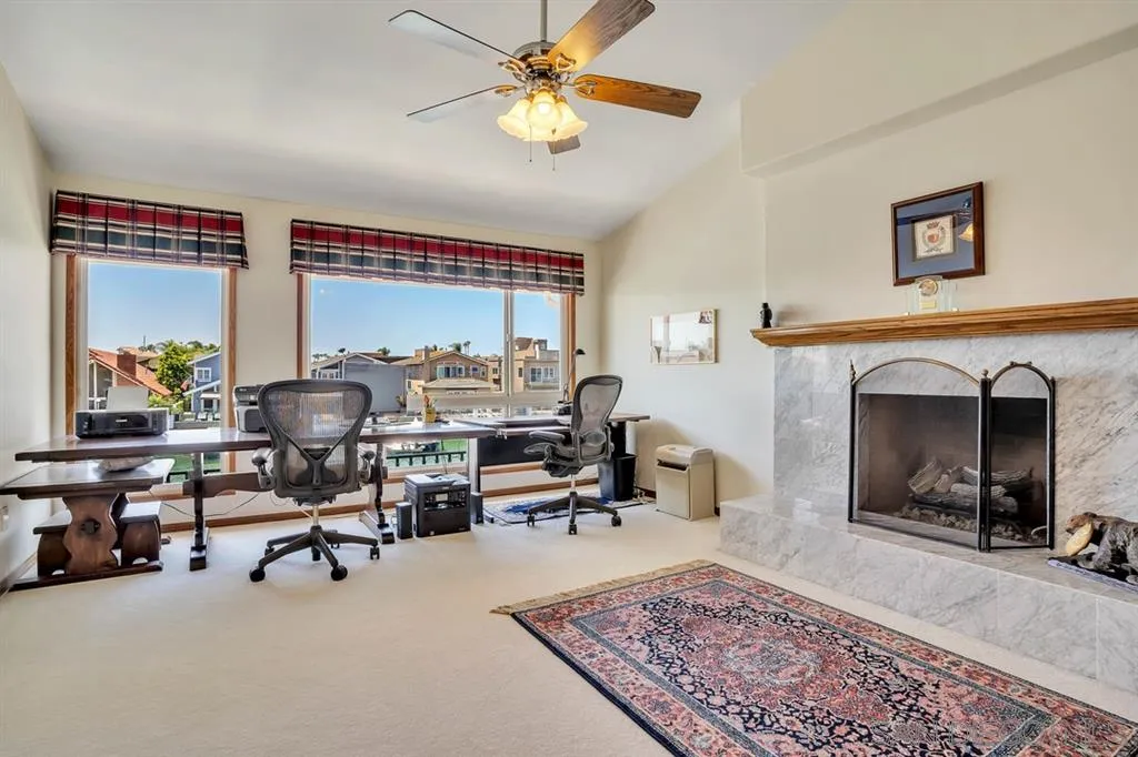 26 The Point Coronado, CA 92118 - Photo 14 of 23 a living room with furniture and a fireplace