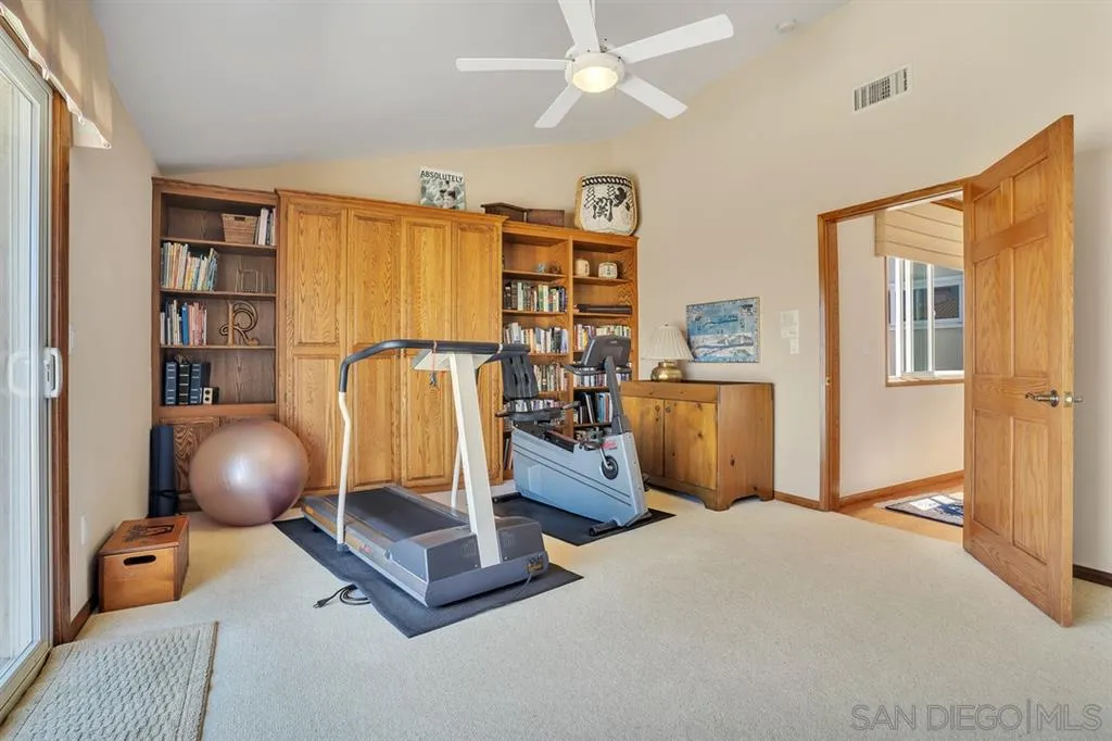 26 The Point Coronado, CA 92118 - Photo 15 of 23 a room with gym equipment and a flat screen tv