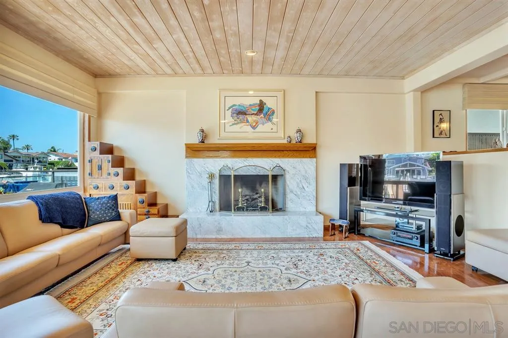 26 The Point Coronado, CA 92118 - Photo 3 of 23 a living room with furniture and a fireplace